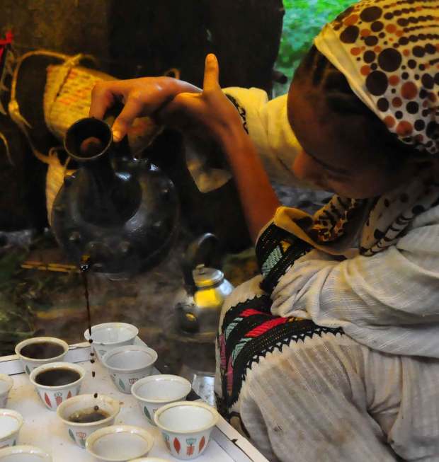 ethiopian woman pouring coffee