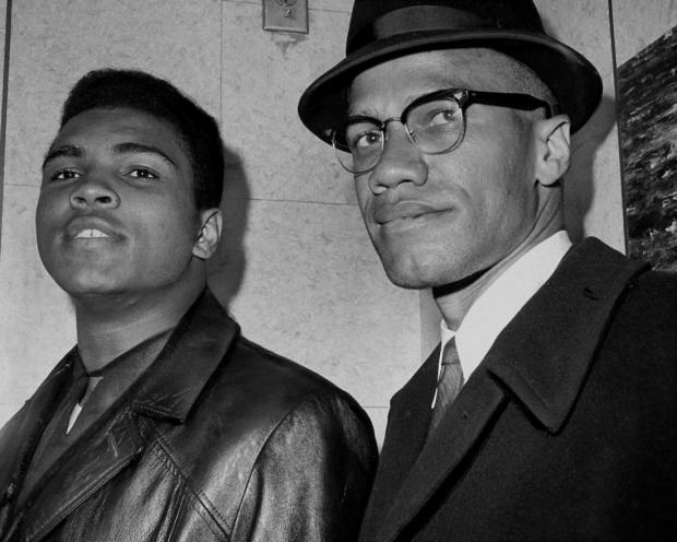 UNITED STATES - MARCH 02: Cassius Marcellus Clay (Muhammad Ali) with Black Muslim leader Malcolm X at 125th St. and Seventh Ave. (Photo by John Peodincuk/NY Daily News Archive via Getty Images)